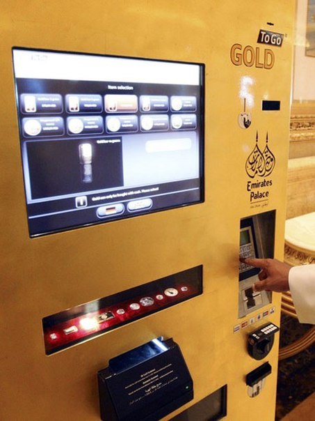 В 2009 году в Абу-Даби (ОАЭ) немецкой компанией TG Gold-Super-Markt был установлен первый банкомат, выдающий золотые слитки. Эта технологическая новинка была установлена в отеле Emirates Palace Hotel, где минимальная стоимость номера начинается с цифры 400$/сутки. Банкомат был назван Gold to Go и имел свои преимущества. Во-первых, оперативность - пользователям золотого банкомата можно купить золотые слитки всего за несколько минут и в любое время суток, при помощи кредитных карточек или наличных. Во-вторых, экономичность - цены в Gold to Go ниже банковских из-за того что отсутствуют расходы на персонал и помещение, плюс в банкомат, в режиме онлайн, поступает информация о ценах на золото с мировых рынков, таким образом цена корректируется каждые 10 минут, что тоже очень удобно. Банкомат выдаёт слитки номиналами 1 грамм, 2, 10 и 1 унция (28.4 грамма). О безопасности немецкие разработчики тоже позаботились - защищает банкомат четырёхсантиметровый слой брони. Даже внешний вид говорит принадлежности банкомата к золоту, хотя на первый взгляд он похож на автомат с газировкой.