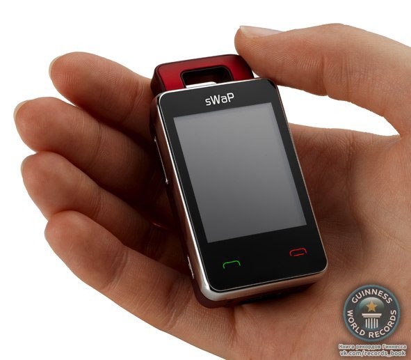 Самый маленький телефон!На звание самого маленького телефона в мире претендуют два миниатюрных аппарата – японский WX03A фирмы Willcom и английский sWaP Nova. Размеры японского аппарата – 70 х 32х 10,5 мм, вес 33 гр. У телефона дюймовый OLED – дисплей, стандартный набор кнопок, инфракрасный порт, зарядка через порт micro USB.Телефон может читать и отправлять сообщения по электронной почте. Заряда батареи хватит на два часа в режиме разговора или на 300 часов в режиме ожидания. В нашей стране телефон работать не сможет, так как работает он в сетях PHS, которые распространены в основном только в Азии.