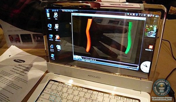 Южнокорейская компания Samsung представила первый в мире ноутбук с прозрачным экраном. Причем эта особенность не мешает работать и даже смотреть видео с яркой и четкой картинкой.