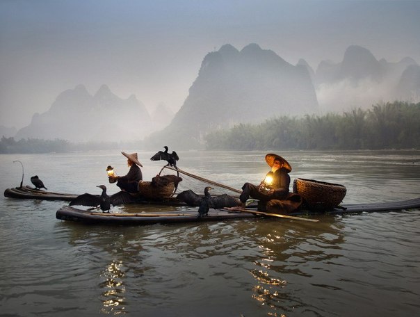 Рыбаки на реке Лицзян, Китай.